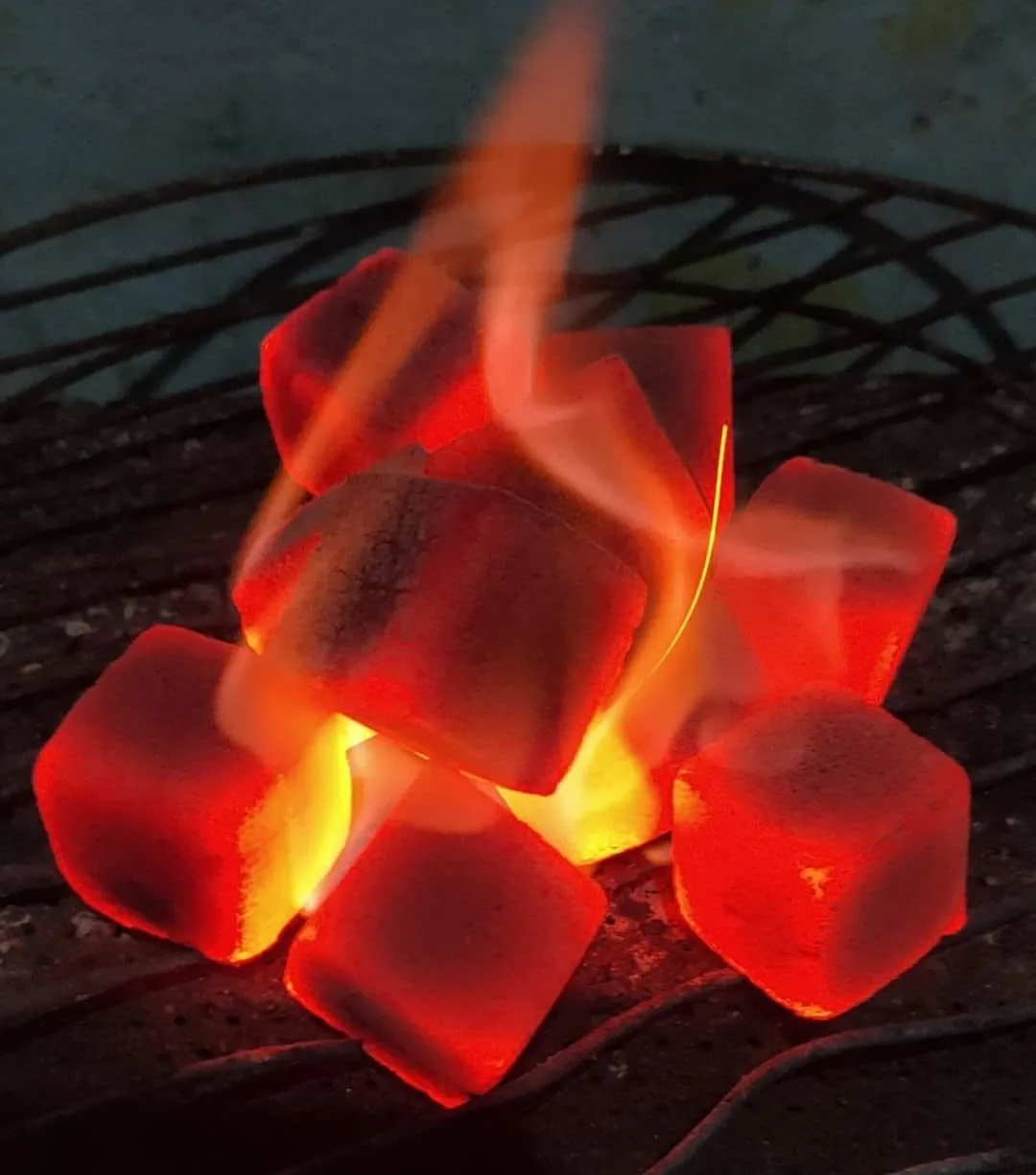 Glowing charcoal briquettes